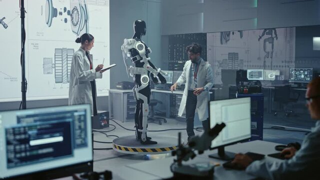 In Robotics Technology Development Laboratory Diverse Team of Engineers Work on a Bionics Exoskeleton Prototype