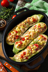 Healthy food. Baked zucchini stuffed with meat and tomatoes in a cast-iron pan.