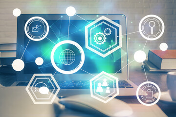 Computer on desktop with social network theme icon. Multi exposure. Concept of international connections.