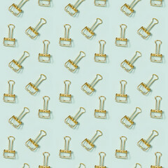 Creative seamless pattern with office supplies, golden metal paper clips. School and education concept.