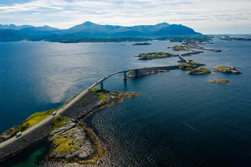 Fotobehang Cars crossing bridges on Atlanterhavsvegen, scenic coastal highway, west coast of Norway © STUEDAL