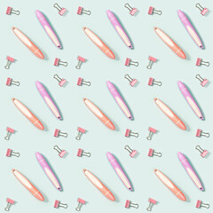 Creative seamless pattern with office supplies, color pencils or markers and metal paper clips. School and education concept.