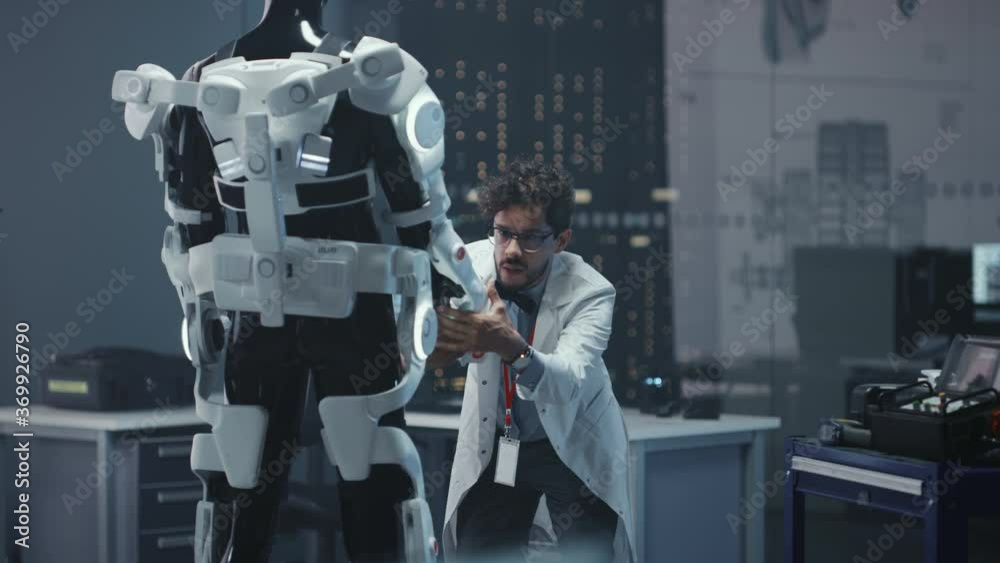 Poster in robotics development laboratory: chief female engineer and top male scientist work on a bionics e