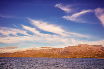 Rocky seashore in the evening. Beautiful nature of Norway. Picturesque Scandinavian landscape. Lofoten islands, Norway, Europe