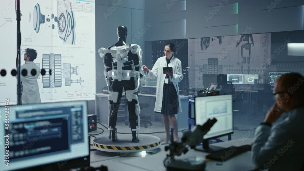 Poster in robotics technology development laboratory diverse team of engineers work on a bionics exoskeleto