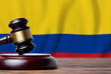 Justice and court concept in Republic of Colombia. Judge hammer on a flag background