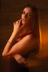 Portrait of a pretty girl with mixed light at studio