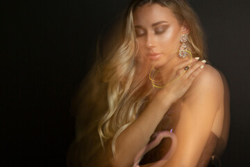 Tender girl with perfect makeup posing with mixed light