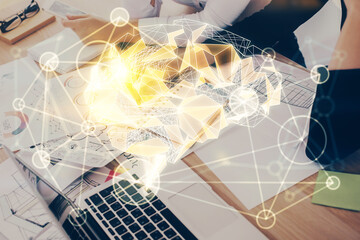 Double exposure of woman's writing hand on background with brain hud. Concept of learning.