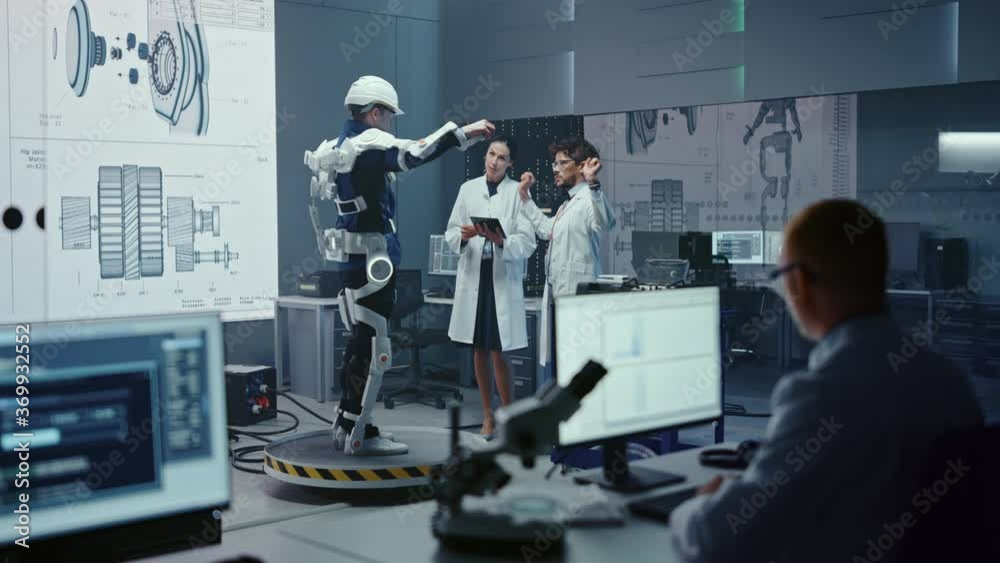 Aufkleber In Robotics Development Laboratory: Engineers and Scientists Work on a Bionics Exoskeleton Prototype with Person Testing it. Designing Wearable Exosuit to Help Disabled People, Warehouse Workers
