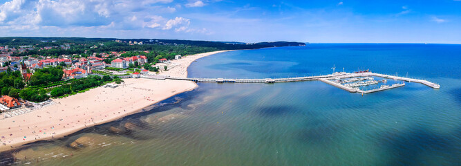 Panorama of the Baltic sea coastline with wooden pier in Sopot, Poland