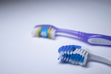 two toothbrushes on a white background. healthy and clean teeth concept, dentistry. High quality photo