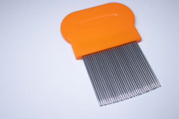 brush-comb for removing lice. white background. isolated. High quality photo