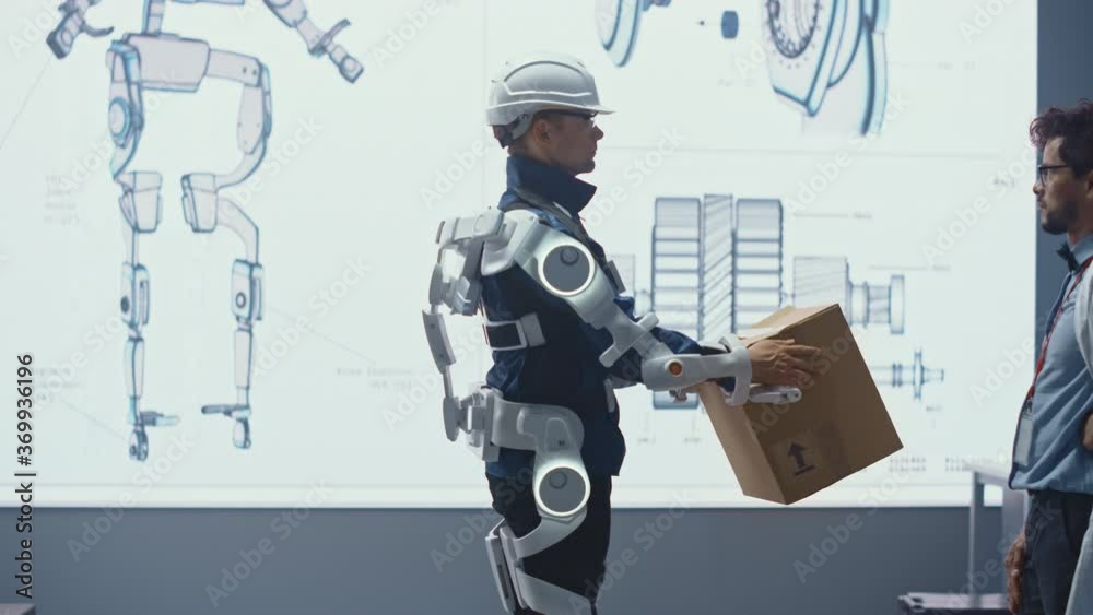 Aufkleber In Development Laboratory: Engineers Look at Robotics Exoskeleton Prototype Presentation with Person Testing it, Lifting Heavy Carboard Box. Designing Wearable Exosuit to Help Warehouse Workers.