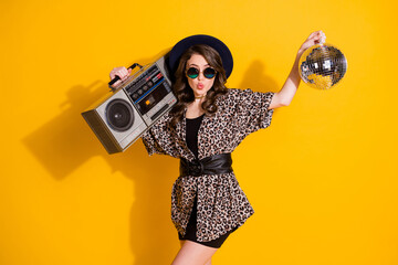 Photo of dreamy cute girl hold glitter ball play record rhythm cassette boom box send air kiss wear...
