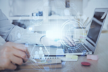 Social network theme hologram with businessman working on computer on background. Concept of world wide web. Multi exposure.