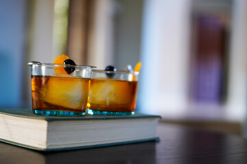 Maple Old-fashioned drinks with maraschino cherry