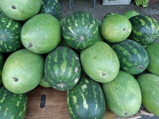 Big stack of watermelons at local Colombian market.