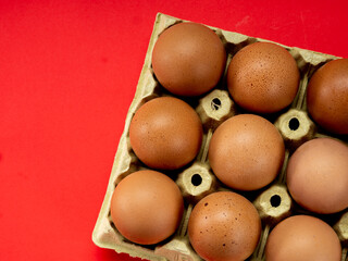 Eggs in a yellow cardboard egg cup