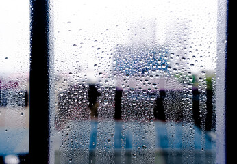 Raindrops on the window at the gloomy morning