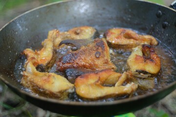 The preparation of the fish caught on fire.