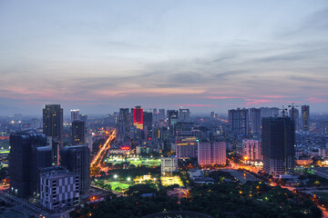 Cityscape of Hanoi skyline in Cau Giay district by Cau Giay park during sunset time in Hanoi city, Vietnam