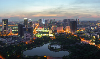 Fototapeta na wymiar Cityscape of Hanoi skyline at Cau Giay park during sunset time in Hanoi city, Vietnam