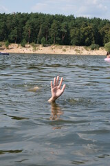 The man is drowning in water. Place for text.
