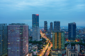 Fototapeta premium Cityscape of Hanoi skyline at Nguyen Chi Thanh street, Dong Da district during sunset time in Hanoi city, Vietnam in 2020