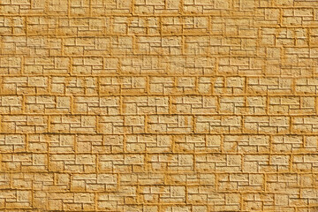 The brick texture. A fragment of yellow facing brick masonry in close-up.