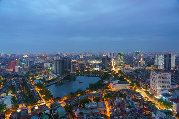 Cityscape of Hanoi skyline at Thanh Cong lake, Dong Da district during sunset time in Hanoi city, Vietnam in 2020