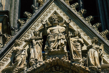 Obraz premium View of the exterior facade of the Roman Catholic Notre Dame de Reims Cathedral, a city in the Grand Est region of France and one of the oldest in Europe 