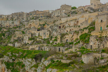 Fototapeta na wymiar Matera ancient town on cliff, dwellings in caves, panorama