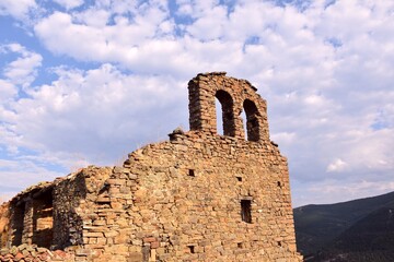 View of the ruins of the 16th century parish church of San Juan Bautista and its belfry, Larriba,...