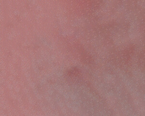 Cosmetic powder sparkling red background