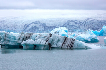 Fototapeta na wymiar Blue Ice on the shore of the ice lagoon in Iceland