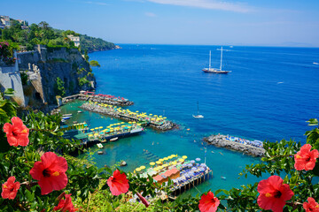 Red flowers. Top view at Sorrento harbor, Amalfi coast, Italy