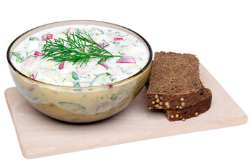 Okroshka with kefir and pieces of rye bread "Borodinsky". Traditional Russian summer cold soup in a glass bowl