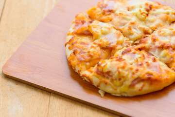 pizza Hawaiian Home made on wood plate