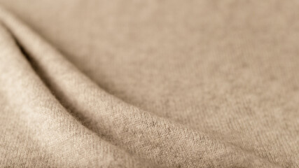 Beige luxury natural cashmere blurred background with copy space