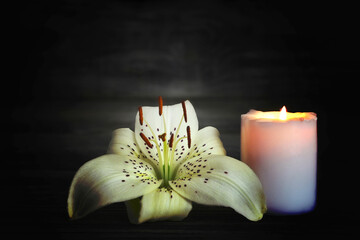 Condolence card. White candle and flower. 