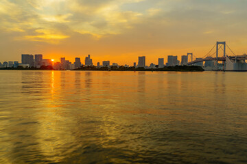 Sunset with city skyline and the Rainbow Bridge, Tokyo