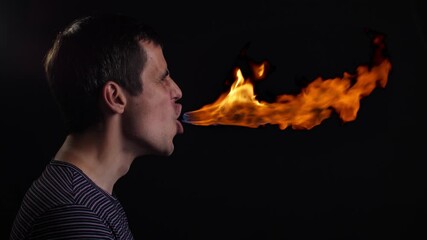 Jet of fire from the mouth of a man
