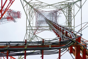 Looked up at the telecommunication tower on a foggy day