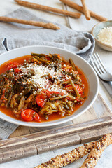  Sauteed green cicory and tomatoes topped with caccioricotta cheese