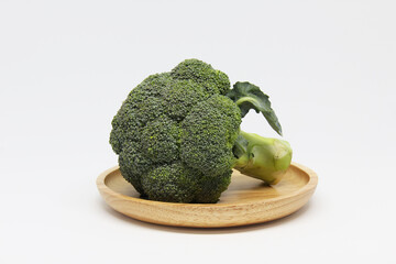 broccoli in wooden plate  