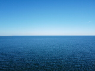 Blue horizon where the cloudless sky and the blue sea converge.