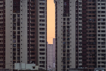 A tall high rise skyscraper in the suburbs of the city of Mumbai.