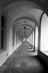 Empty vintage galleryю corridor with arches.