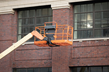 crane bucket is ready to lift you high to work on repairs